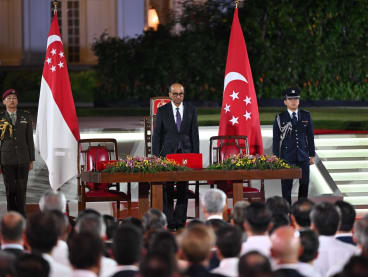 President Tharman Shanmugaratnam (centre) at the swearing-in ceremony of Singapore Prime Minister Lawrence Wong.