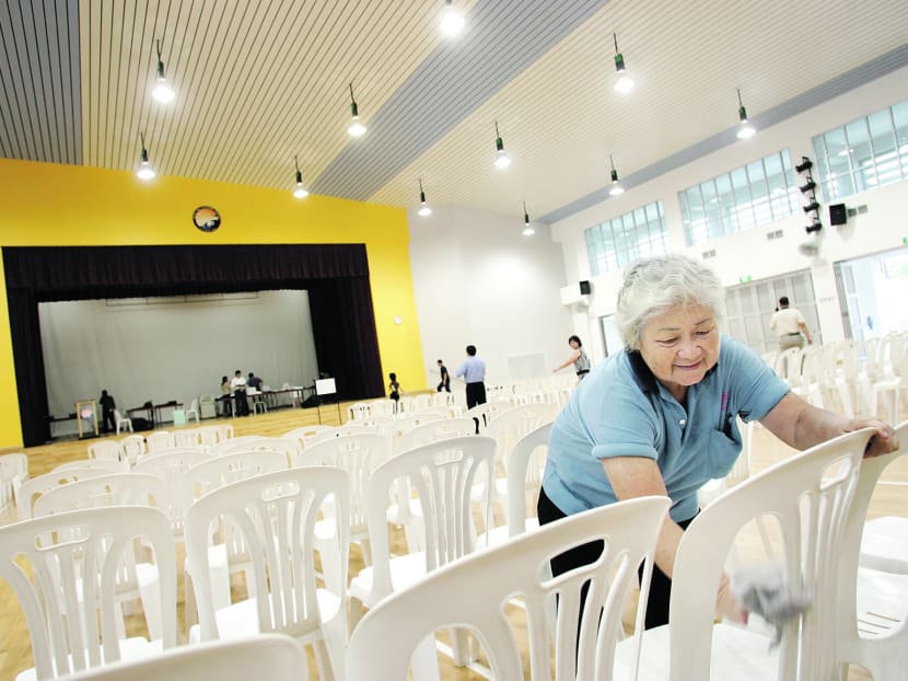 A cleaner helps to prepare Bedok View Sec School's hall for use on Nomination Day in the 2011 General Election. TODAY file photo