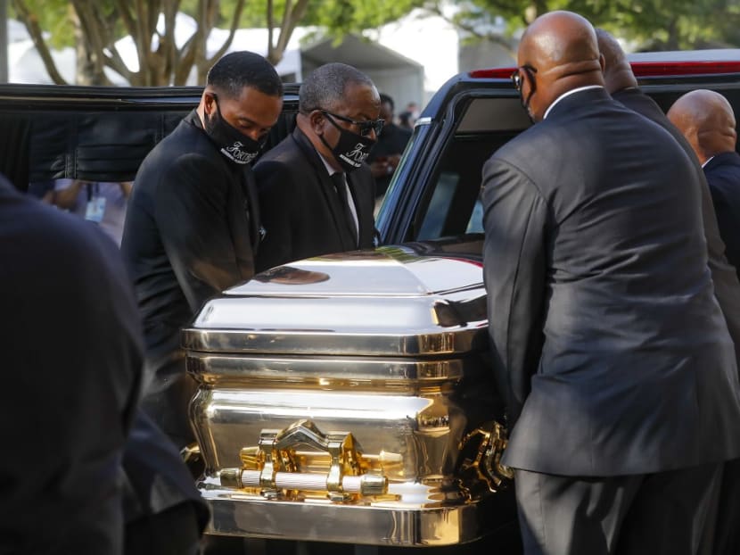 George Floyd's casket is loaded into a hearse after being brought out of The Fountain of Praise church following a public visitation at the Fountain of Praise church June 8, 2020 in Houston, Texas.