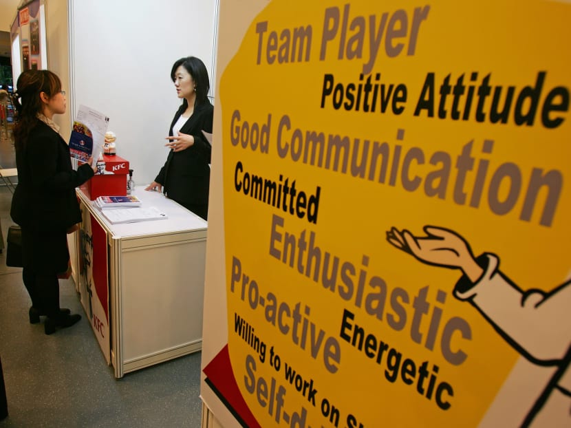 A jobseeker checks out a booth at a job fair for university graduates in Hong Kong. A study by McKinsey and Company found that Hong Kong’s education system is not meeting the requirements of employers in the city.