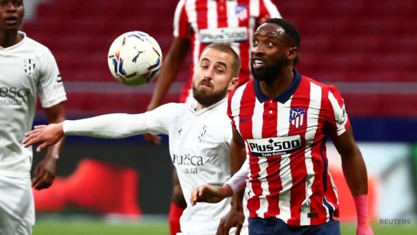 Football: Atletico see off Huesca to stay in control of La Liga title race Football: Atletico see off Huesca to stay in control of La Liga title race