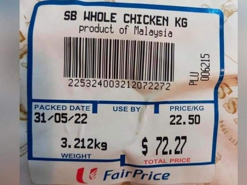 A photograph of a price label showing "SB Whole Chicken" on sale at S$72.27 for a 3.21kg packet at NTUC FairPrice supermarket.