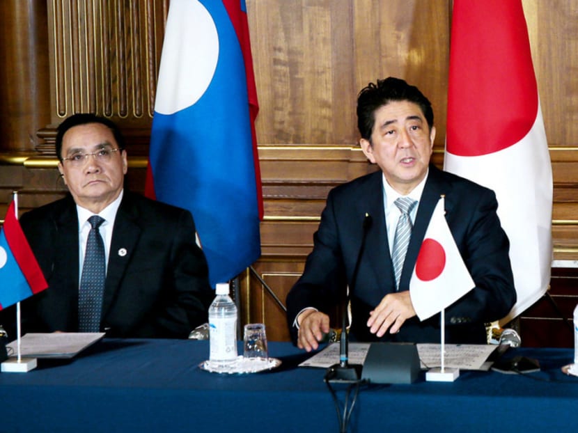 (From left) Laos Prime Minister Thongsing Thammavong, Japanese Prime Minister Shinzo Abe and Myanmar President Thein Sein at a press conference in Tokyo on July 4. Japan pledged S$8.27 billion in official development assistance to five nations along the Mekong River over the next three years. Photo: Kyodo News