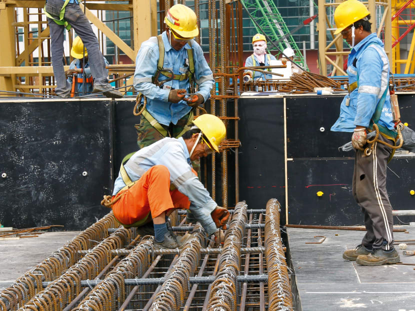 Construction workers working at a construction site. TODAY file photo