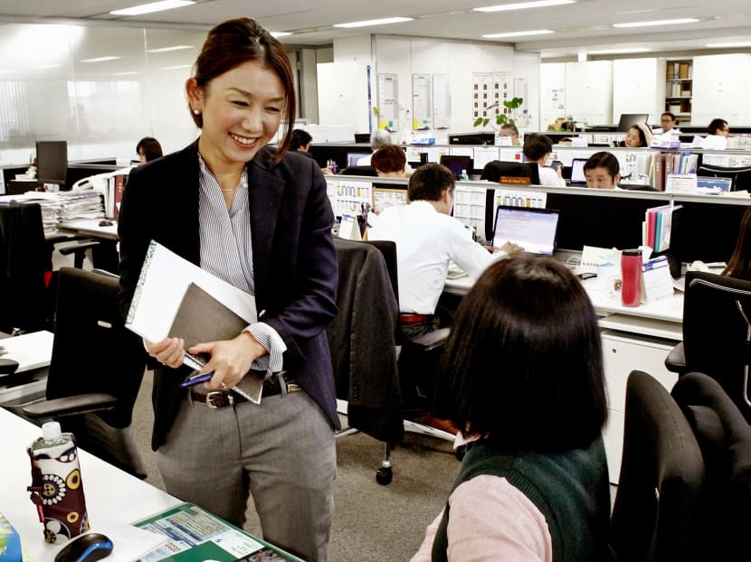 Despite a slew of regulations introduced by Japanese PM Shinzo Abe since 2013 to move women up the corporate ladder, the country’s culture of long working hours, coupled with a dearth of support for childcare, continues to put women at a disadvantage when it comes to promotions. Photo: Kyodo