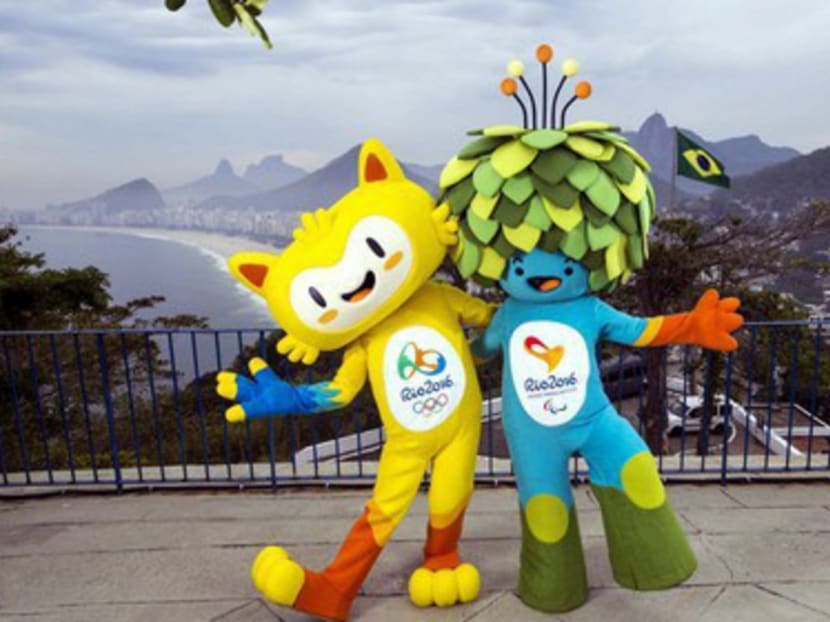 The mascots of the Rio 2016 Olympic (left) and Paralympic Games with the Copacabana beach in the background. The mascots are inspired by Brazilian fauna and flora. Photo: AP
