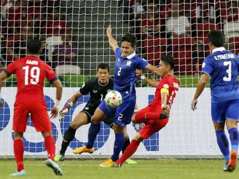 Singapore playing Thailand during the recent AFF Suzuki Cup Group B match in Singapore. Photo: AP