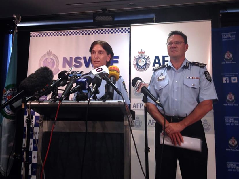 Australian Federal Police Deputy Commissioner Michael Phelan (right) listens as New South Wales Deputy Police Commissioner Catherine Burn speaks during a media conference in Sydney on Feb 11, 2015. Photo: Reuters