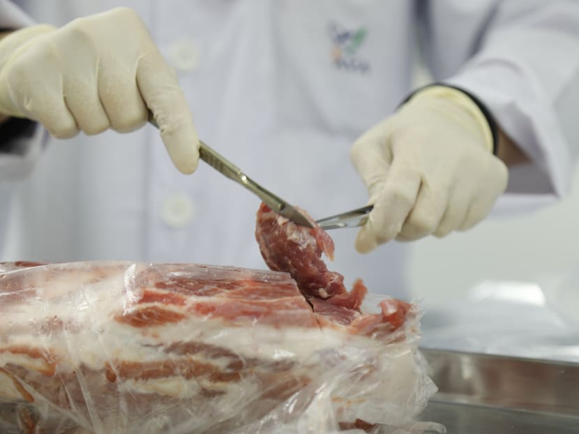 An Agri-Veterinary Authority of Singapore (AVA) officer testing meat samples at the drug residue lab. The AVA said that it is strengthening its regulatory framework on the veterinary use of human therapeutic products, such as antibiotics, hormones and insulin. TODAY File Photo