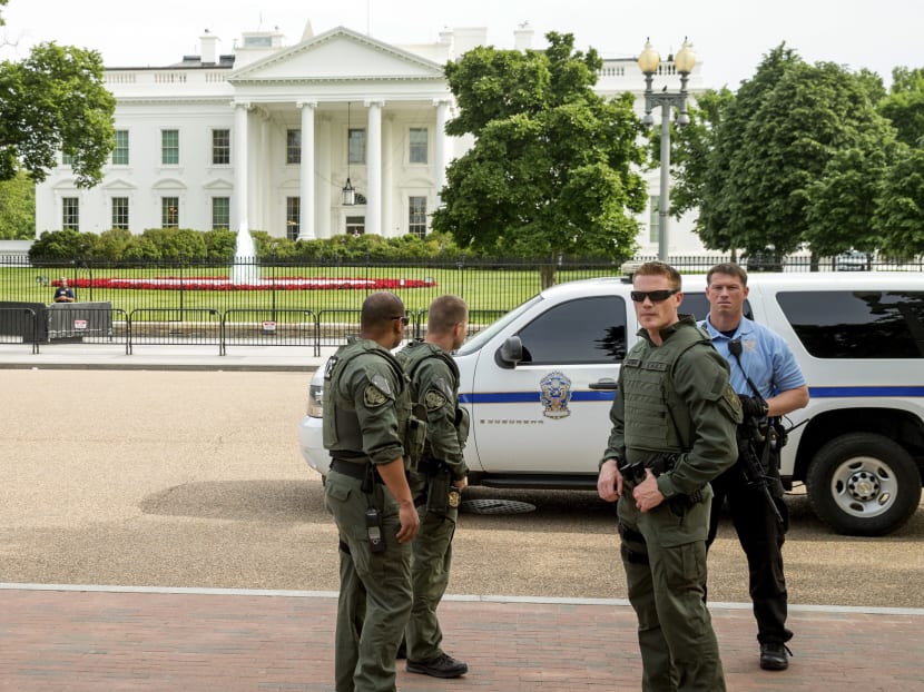 Security personnel stand in front of the White House. Photo: AP