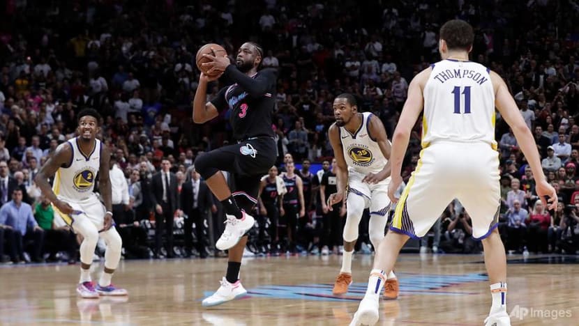 Basketball: Ageless Wade lifts Heat over Warriors, Bucks edge Kings