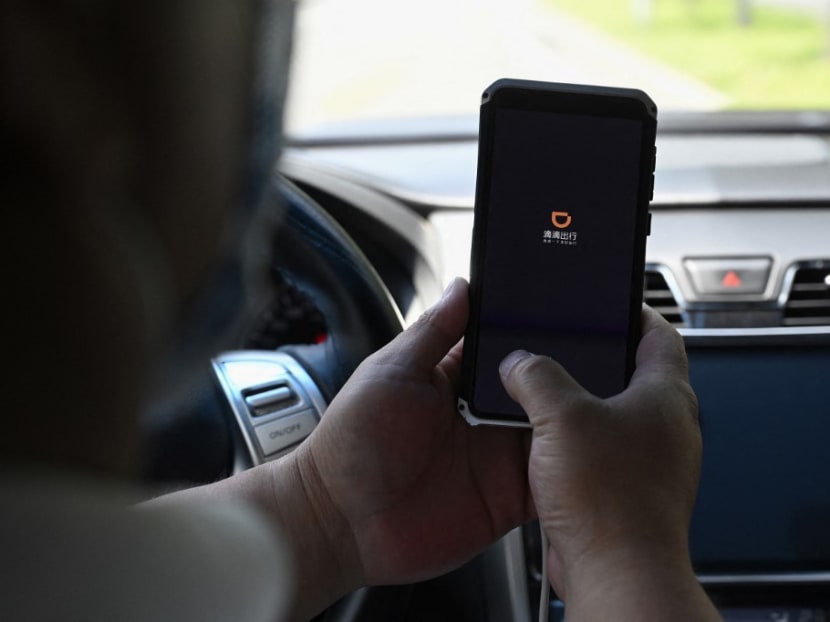 This file photo taken on July 2, 2021, a driver opens the Didi Chuxing ride-hailing app on his smartphone in Beijing. This file photo taken on July 2, 2021, a driver opens the Didi Chuxing ride-hailing app on his smartphone in Beijing. 