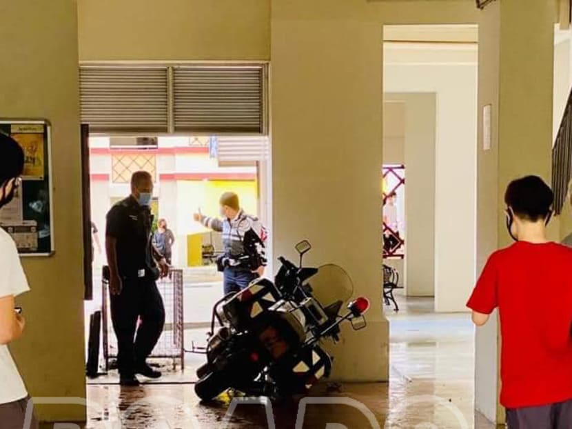 A photo on social media allegedly showing a traffic police motorcycle that had crashed into a pillar at the void deck of a HDB block in Ang Mo Kio during the chase.