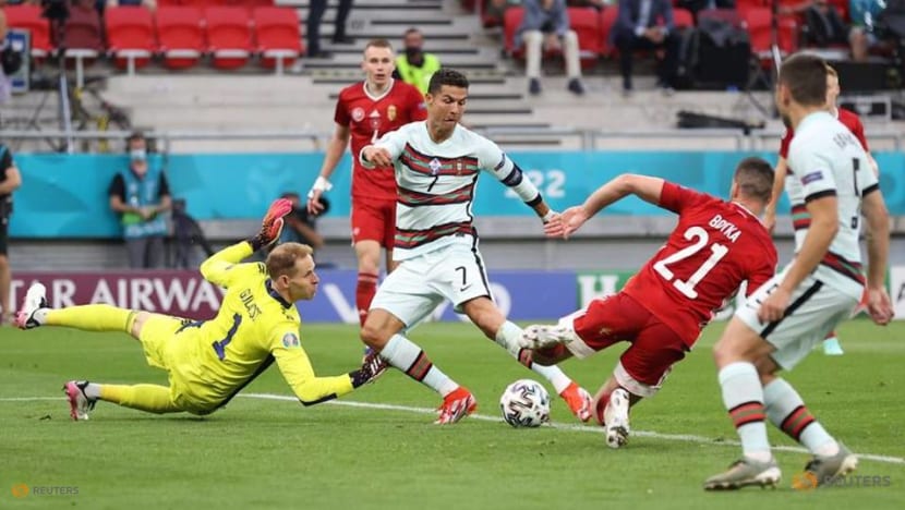 Football: Record-breaking Ronaldo strikes late as Portugal sink Hungary Football: Record-breaking Ronaldo strikes late as Portugal sink Hungary