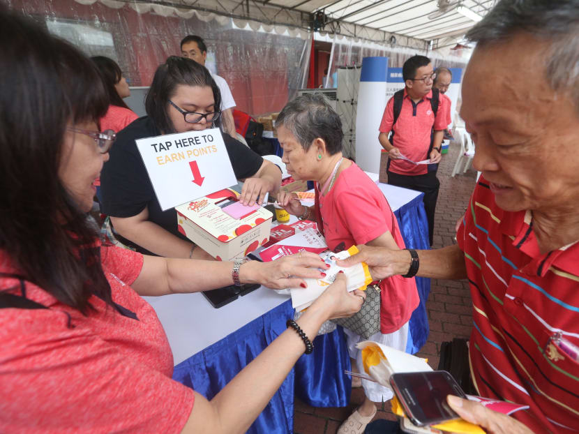 Residents of Bishan-Toa Payoh GRC signing up for the Bishan-Toa Payoh GRC Programme for Active Living (PAL) challenge at its launch at Toa Payoh Central Amphitheatre on Sunday (Oct 14). The PAL challenge is a loyalty programme designed to encourage Bishan-Toa Payoh residents to lead an active lifestyle.