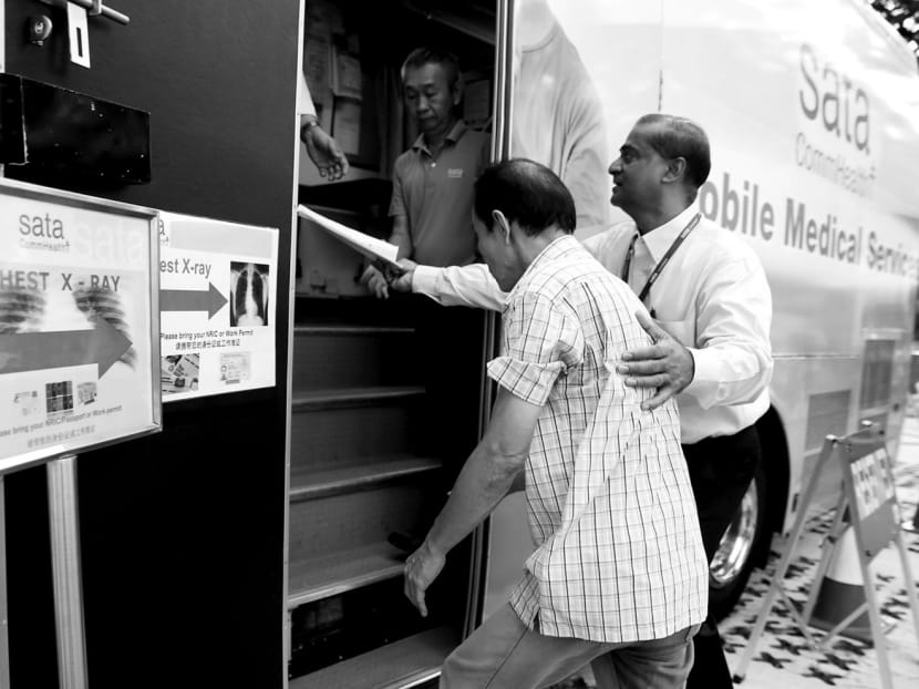 A resident enters a mobile medical services vehicle for a chest X-ray at an MOH health screening at Ang Mo Kio Avenue 3 in June 2016. TB remains an epidemic in most countries, including Singapore. More resources have been provided by the Ministry of Health to address the rise in TB rates. TODAY file photo