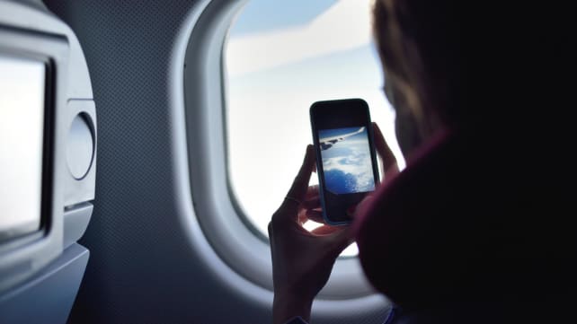 CNA Explains: Should you switch off your phone while on a flight?