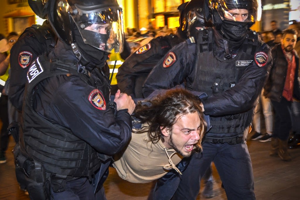 Police officers detain a man following calls to protest against partial mobilisation announced by Russian president Vladimir Putin, in Moscow, on Sept 21, 2022. Police officers detain a man following calls to protest against partial mobilisation announced by Russian president Vladimir Putin, in Moscow, on Sept 21, 2022.