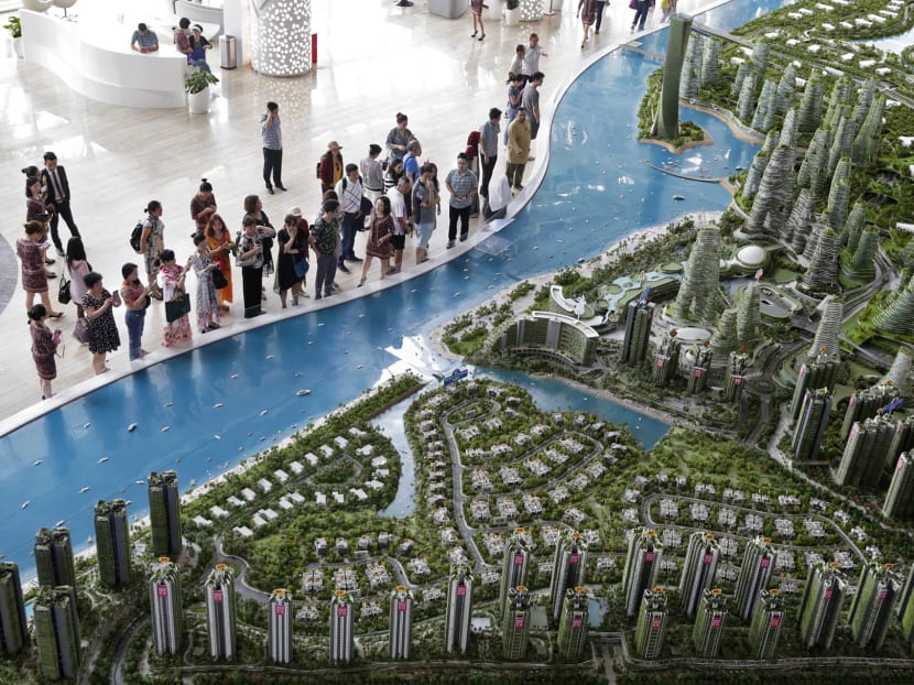 Visitors view the scale model of development at Forest City in Johor.  China’s growing presence in Johor are viewed with mild disdain by locals, who instead favour investments from their southern neighbours in Singapore. Photo: TODAY file picture