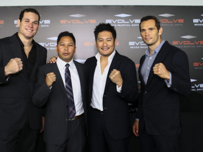 (From left) ONE FC fighter Roger Gracie, ONE FC CEO Victor Cui, Evolve MMA founder and chairman Chatri Sityodtong, and ONE FC vice-president Rich Franklin at the opening of Evolve MMA's new outlet at Orchard Central. Photo: Evolve MMA