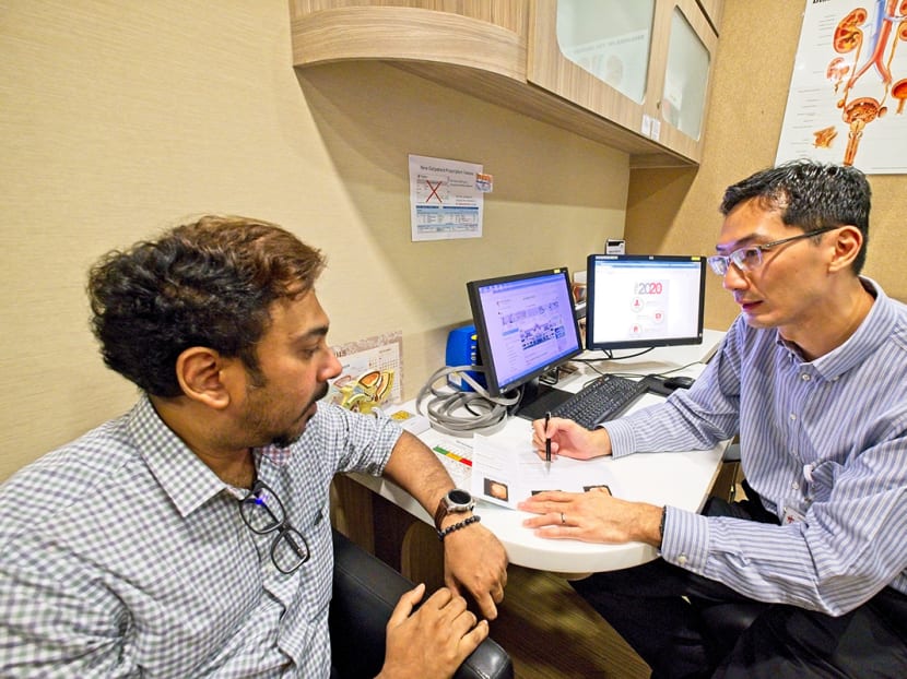 Adjunct Assistant Professor Png Keng Siang (right) with a man posing as a patient in a urology clinic setting. Adjunct Assistant Professor Png Keng Siang (right) with a man posing as a patient in a urology clinic setting.