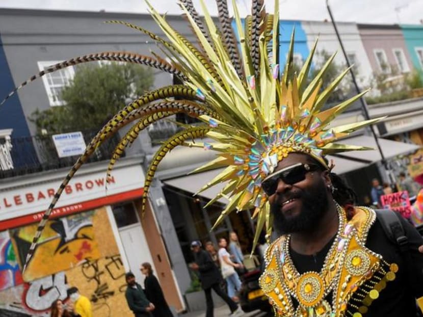 Lone revellers brighten Notting Hill's empty streets on carnival day Lone revellers brighten Notting Hill's empty streets on carnival day