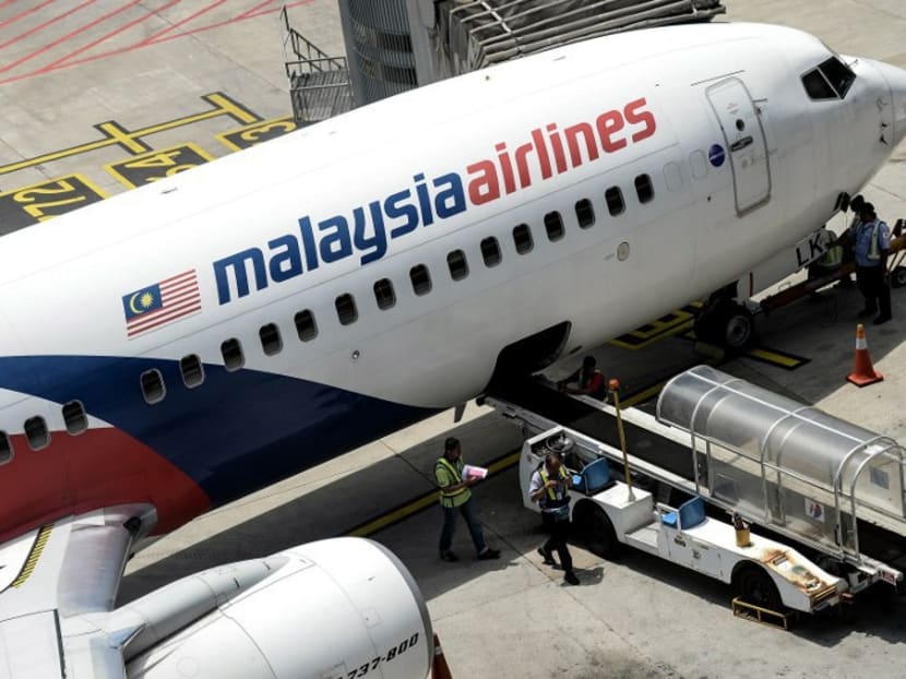 Malaysia Airlines groundstaff on the tarmac at Kuala Lumpur International Airport. AFP file photo