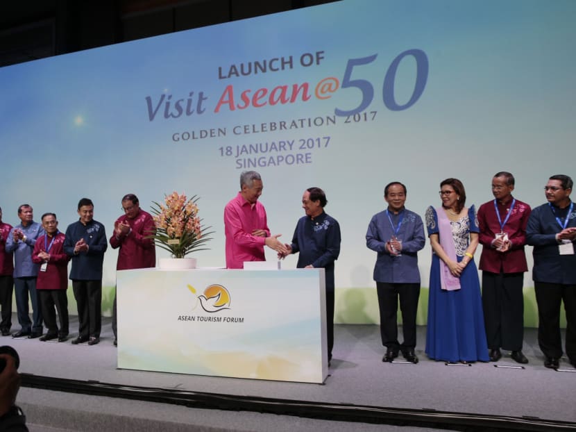 PM Lee Hsien Loong attends the ASEAN Tourism Forum Opening Gala orchid naming ceremony with ASEAN secretary-general H.E. Le Luong Minh and ASEAN tourism ministers on Jan 18, 2017. Photo: Jason Quah/TODAY