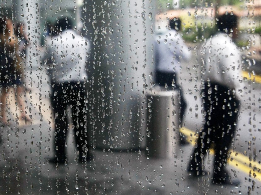 Office workers are reflected in a rain-covered window as they stand at the lobby of a building in Singapore's financial district. Reuters file photo Office workers are reflected in a rain-covered window as they stand at the lobby of a building in Singapore's financial district. Reuters file photo