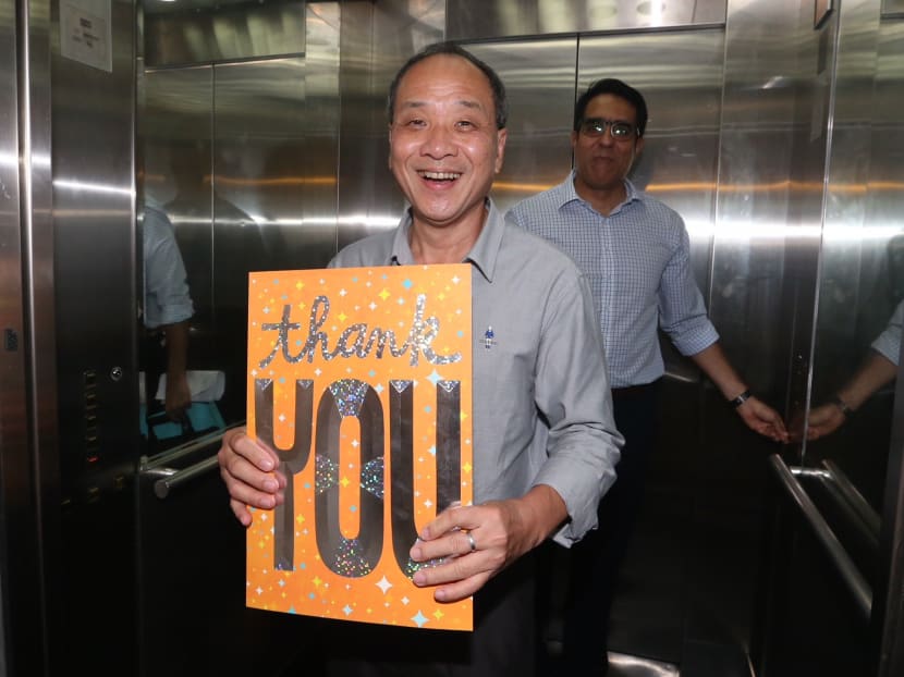 Outgoing WP chief Low Thia Khiang holding a thank you card from party members at the party's CEC elections on April 8.