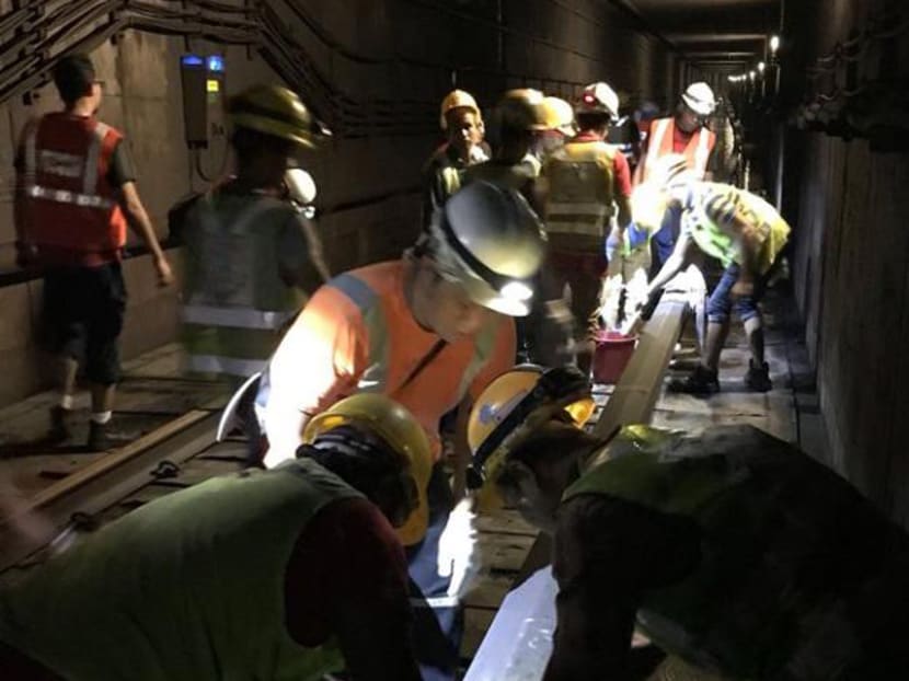 Engineers work to clear a flooded tunnel between Braddell and Bishan MRT stations on Oct 7.  Photo: LTA