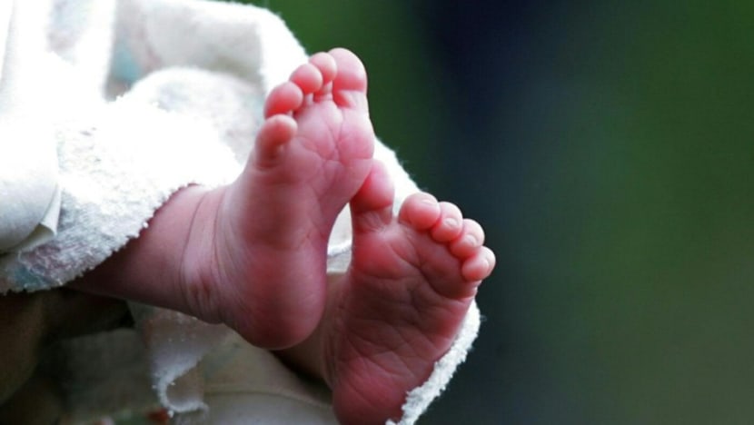 Indian police rescue baby being buried alive