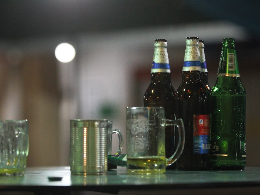 Empty beer bottles left discarded at a food centre in Ang Mo Kio. TODAY file photo