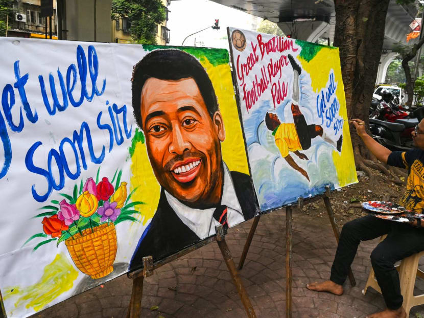 An art school teacher gives final touches to a painting of Brazilian football legend Pele, with a message for his good health in Mumbai on Dec 4, 2022.
An art school teacher gives final touches to a painting of Brazilian football legend Pele, with a message for his good health in Mumbai on Dec 4, 2022.