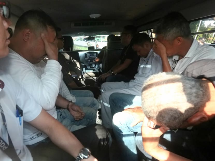 Some of the 17 men arrested for suspected involvement in misappropriating fuel from Shell Bukom. Photo: Nuria Ling/TODAY