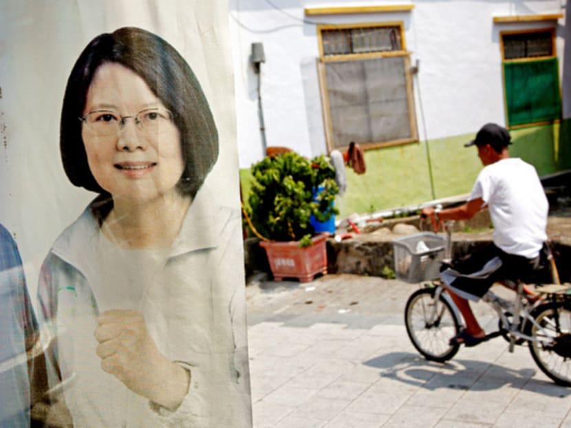 A man riding past an image of Taiwan’s President-elect Tsai Ing-wen. Reuters file photo
