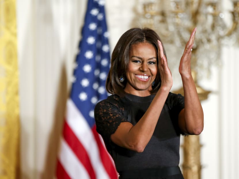 First lady Michelle Obama claps after speaking at an event to mark Nowruz in the East Room of the White House in Washington. Photo: AP