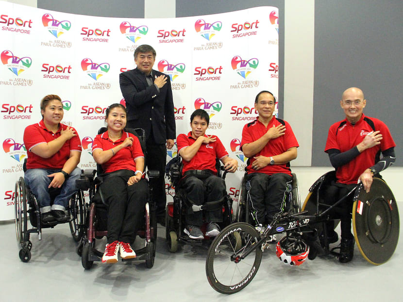 Chairman of the Executive Committee organising the 8th Singapore ASEAN Para Games Lim Teck Yin (standing) with Para Games athletes (from left, seated) Theresa Goh, Jeralyn Tan, Neo Kah Whye, Eugene Soh and William Tan doing the BackUp Pledge at the press conference. Photo: Jaslin Goh