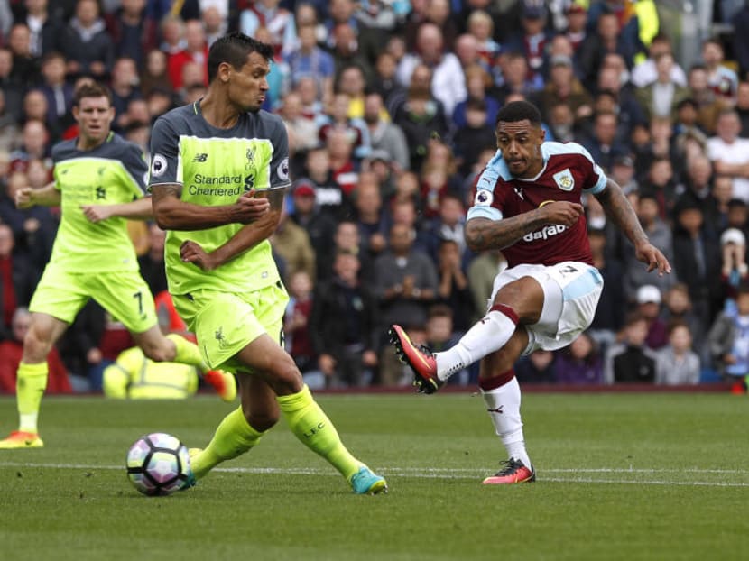 Burnley's Andre Gray scores his team's second goal in their 2-0 Premier League win over Liverpool on Saturday(Aug 20). Photo: Reuters