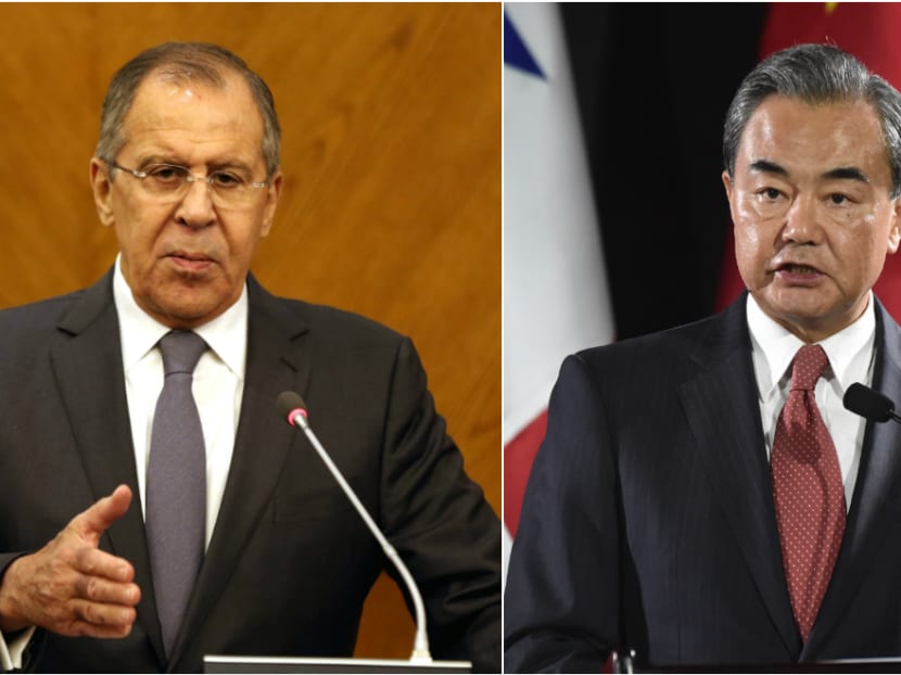 Russia's foreign minister Sergei Lavrov (left) and his Chinese counterpart Wang Yi  have called for a peaceful end to the stand-off with North Korea. Photos; AFP
