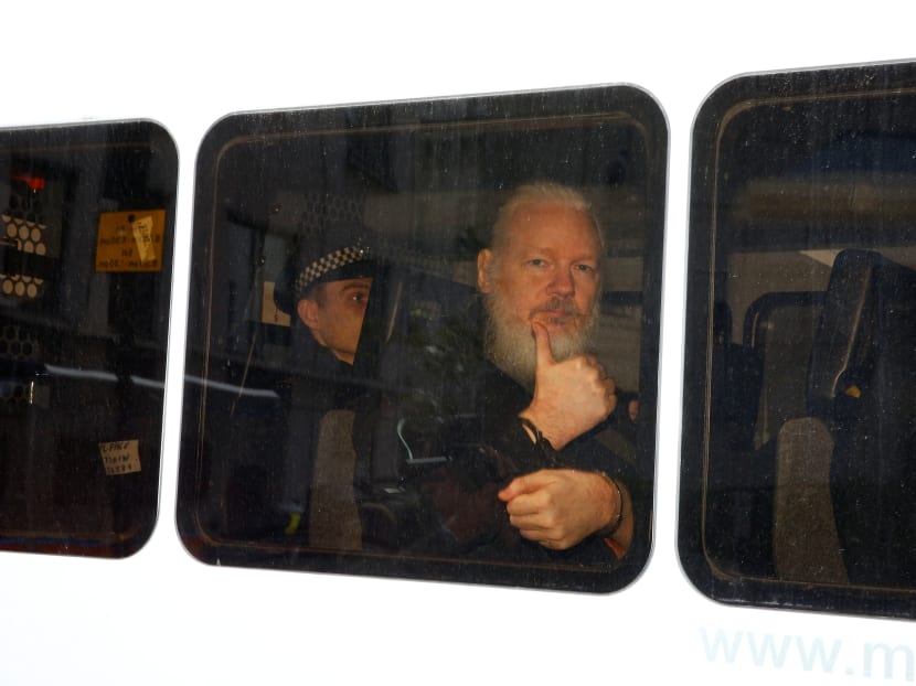 WikiLeaks founder Julian Assange is seen in a police van after he was arrested by British police outside the Ecuadorian embassy in London, Britain on April 11, 2019.