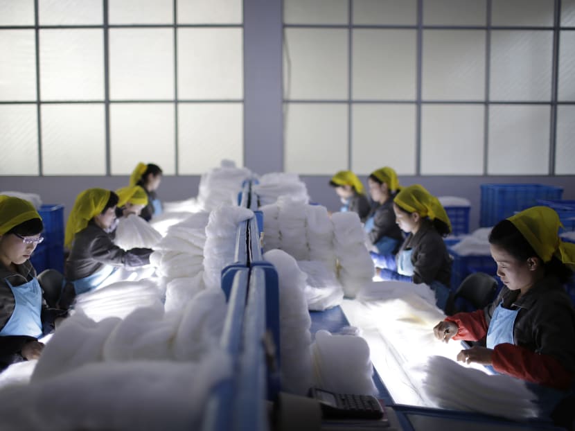 Gallery: Silk, steam and slogans: Inside a North Korean factory