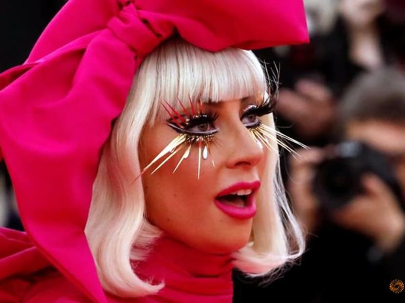 Lady Gaga's dog walker shot and 2 dogs stolen, singer offers US$500,000 reward for return Lady Gaga's dog walker shot and 2 dogs stolen, singer offers US$500,000 reward for return
