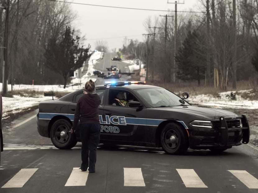 A police road block restricts access to Oxford High School following a shooting on Nov 30, 2021 in Oxford, Michigan