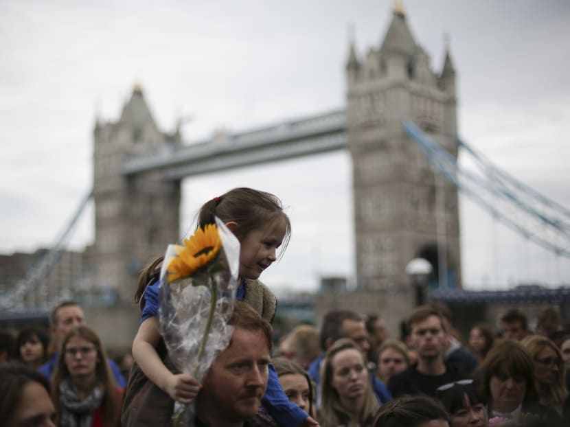 People gather for a vigil in Potters Fields Park in London on June 5, 2017 to commemorate the victims of the terror attack on London Bridge and at Borough Market that killed seven people on June 3. Photo: AFP