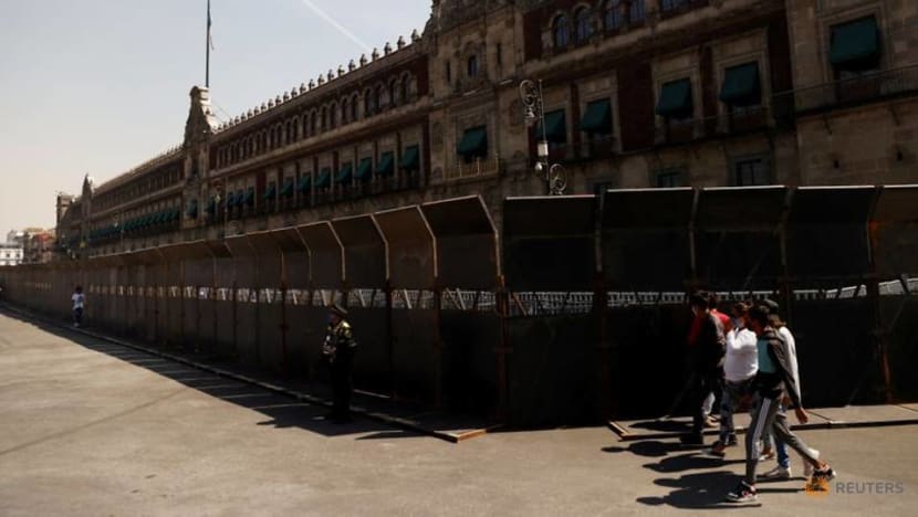 Mexican president defends 10-foot barriers to wall off women protesters Mexican president defends 10-foot barriers to wall off women protesters