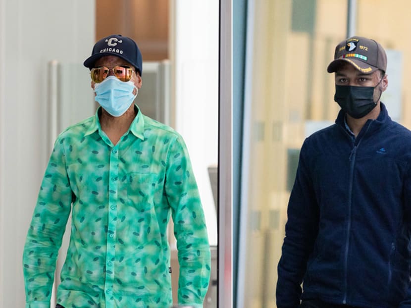 Injured workers Hussain Jitu (left) and Molla Md Yousuf outside the State Courts where they testified before an inquiry committee on Sept 28, 2021.