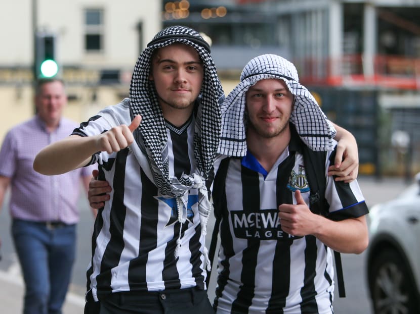 Newcastle fans don Saudi Arabian headwear at St James's Park, Newcastle, as news of a takeover emerged on Oct 7, 2021.
