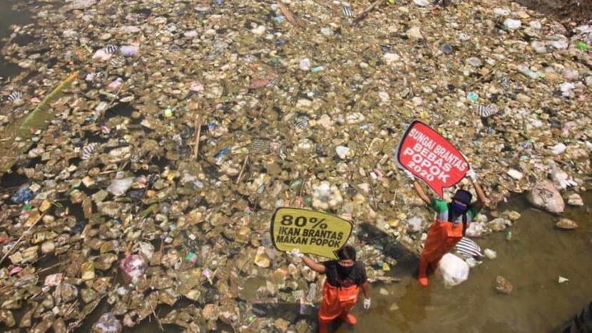 'The smell is extraordinary': Indonesia volunteers aim to free rivers of soiled diapers