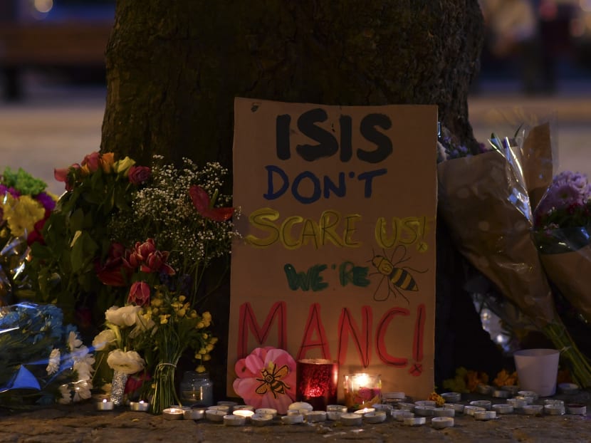 Messages and floral tributes are seen in Albert Square in Manchester, northwest England on May 23, 2017, in solidarity with those killed and injured in the May 22 terror attack at the Ariana Grande concert at the Manchester Arena. Photo: AFP